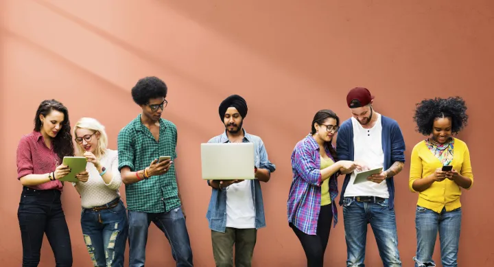 Students in front of orange wall