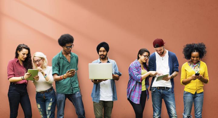 Students in front of orange wall