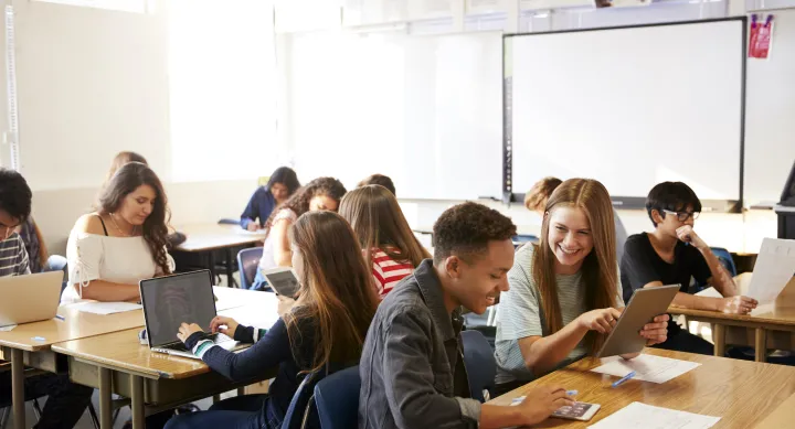 Students working together at tables